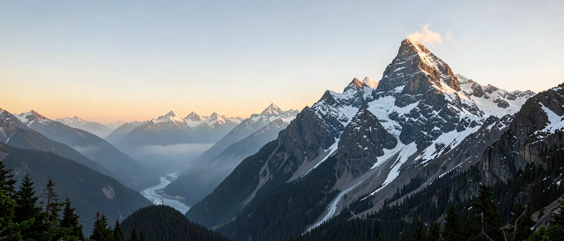 Everest and snow peaks glowing at dawn above a deep Himalayan valley and pine forest, Nepal