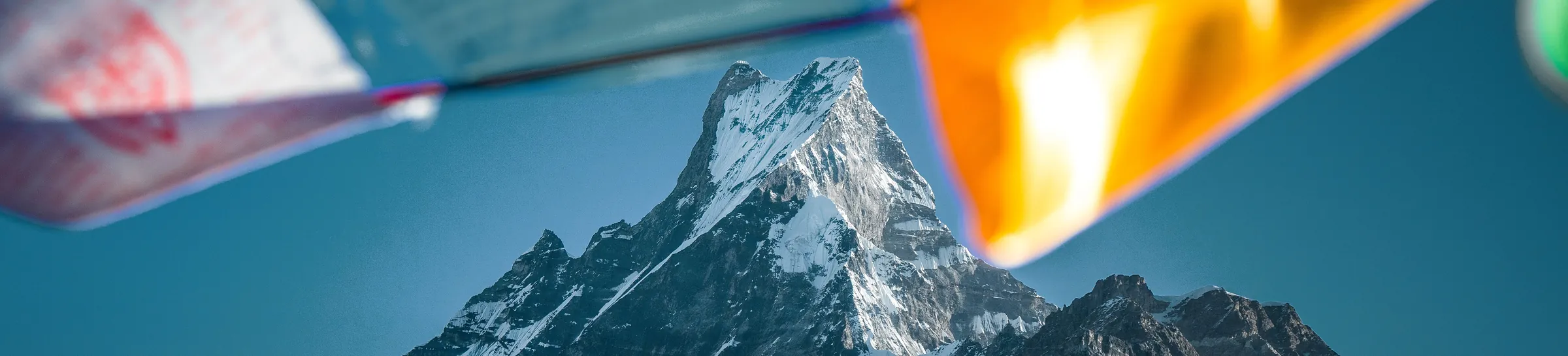 Machapuchare framed by prayer flags, Nepal